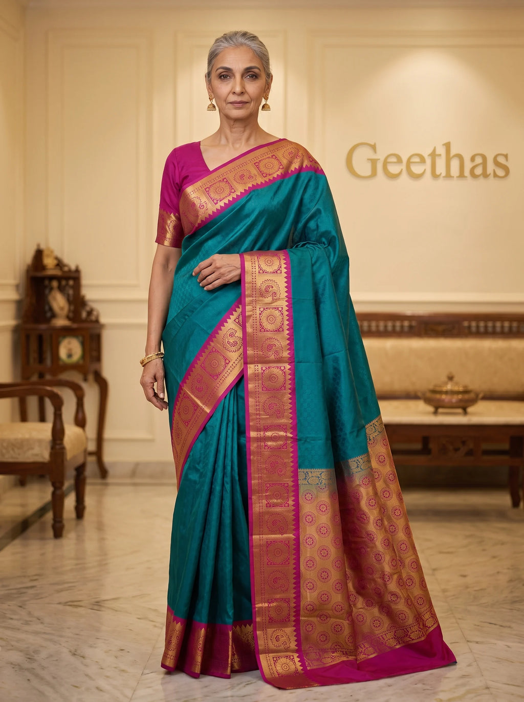 Model wearing a teal blue semi silk saree with magenta zari border and ornate pallu