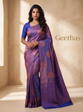 Model wearing lavender soft silk saree with woven motifs, royal blue border and geometric pallu